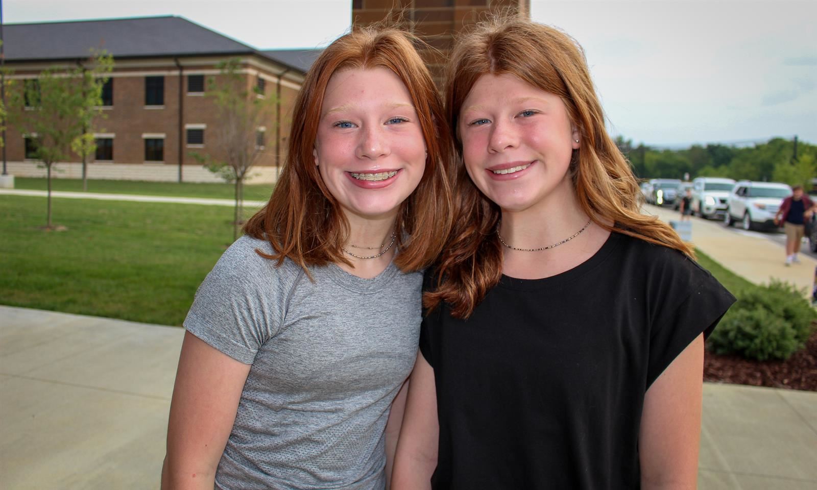 Two girls smile